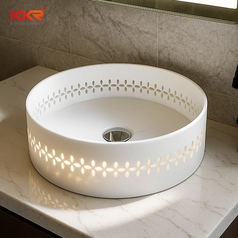 Exquisito lavabo de superficie sólida ahuecado: moderno lavabo redondo de encimera para baños de lujo. 1