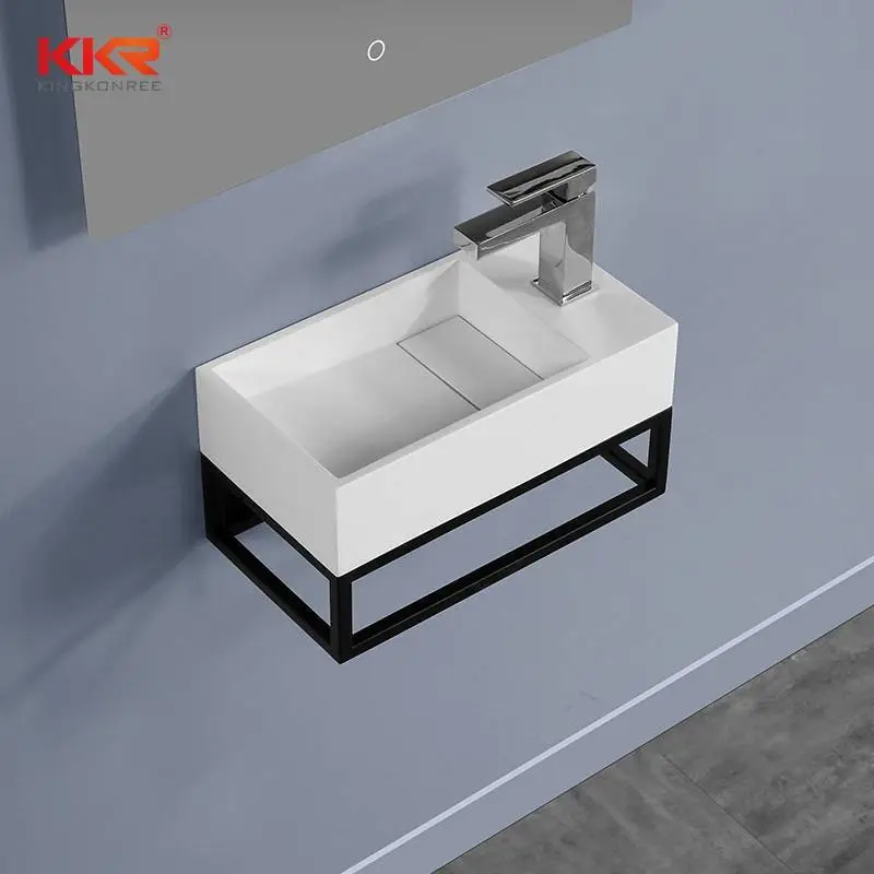 De Nederlandse markt Hot Selling Solid Surface wandhangende wastafel met roestvrijstalen plankrek KKR-1106 1
